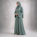Sage Serenity – Pastel Green Heart-Embroidered Abaya